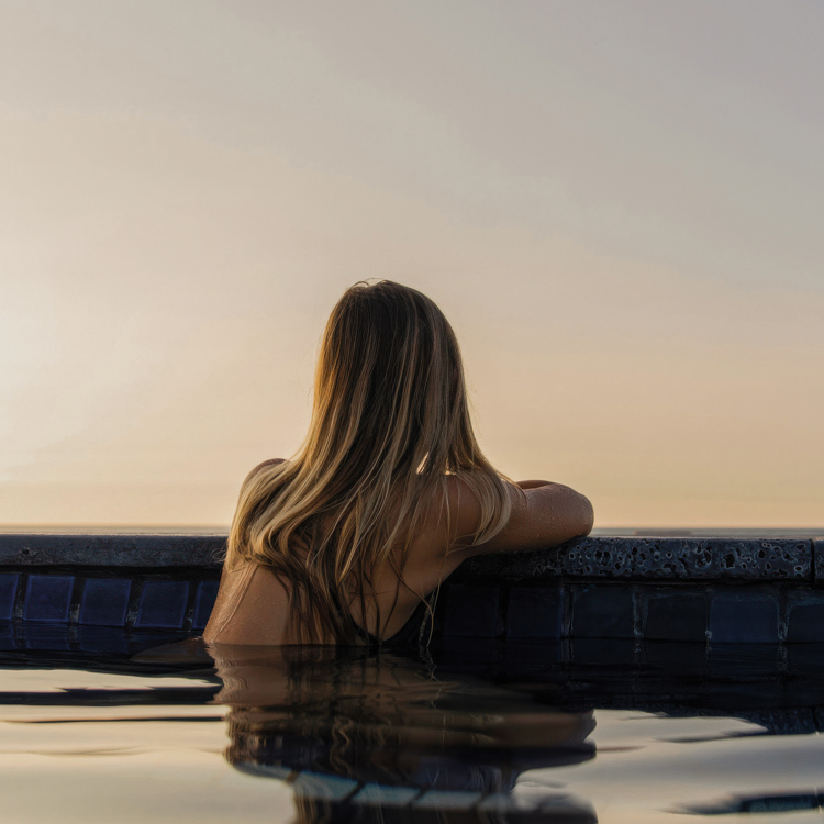 A woman in an infinity pool