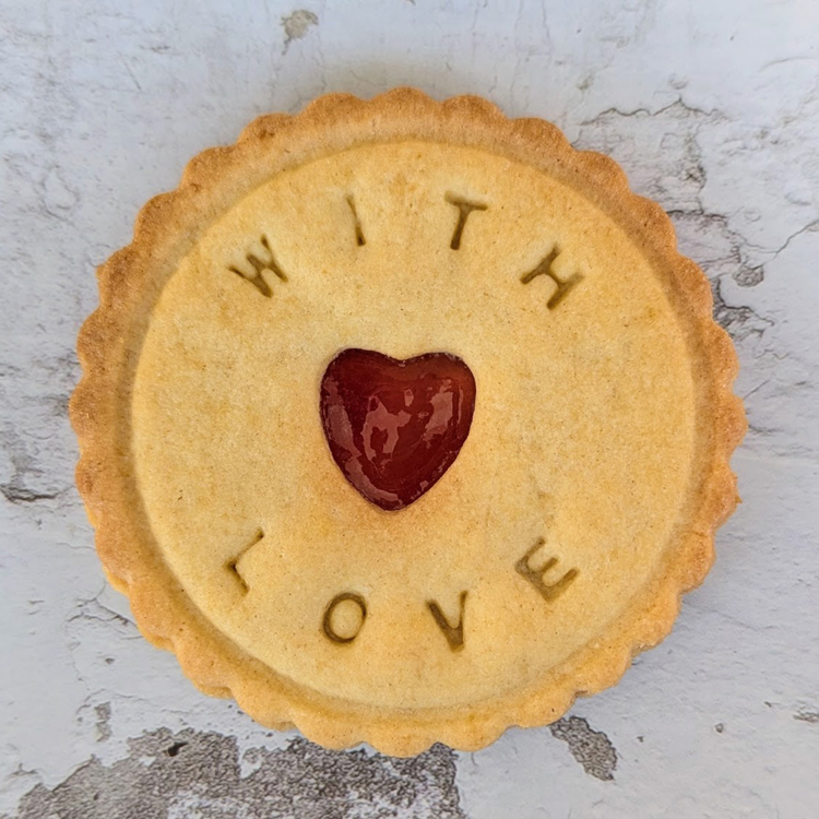 A biscuit with 'love' written on it.