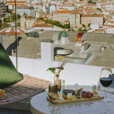 A comfortable chair overlooking Lisbon on the roof of The Lumiares.