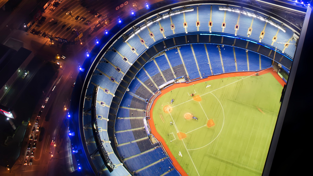 Looking directly down at a baseball stadium at night.