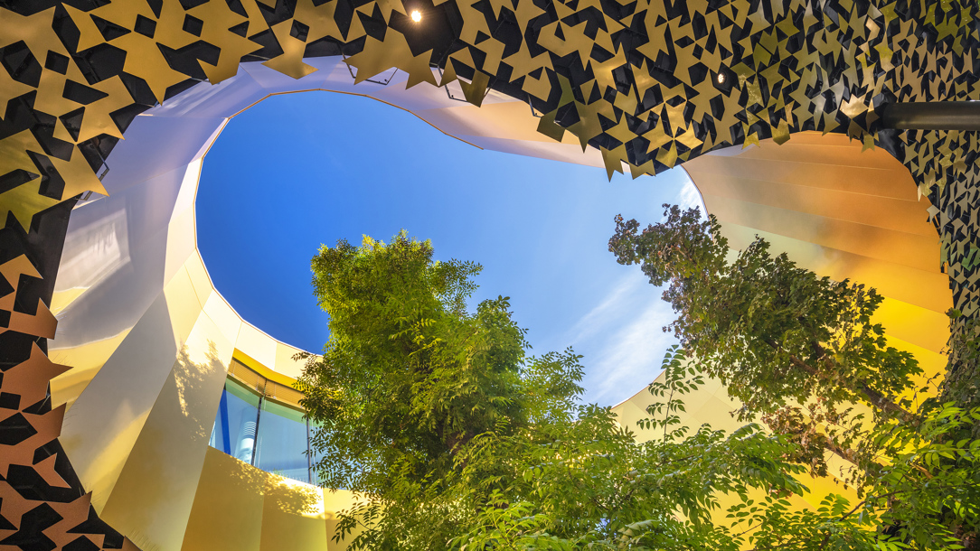 Looking up at the modern architecture of the House of Music.