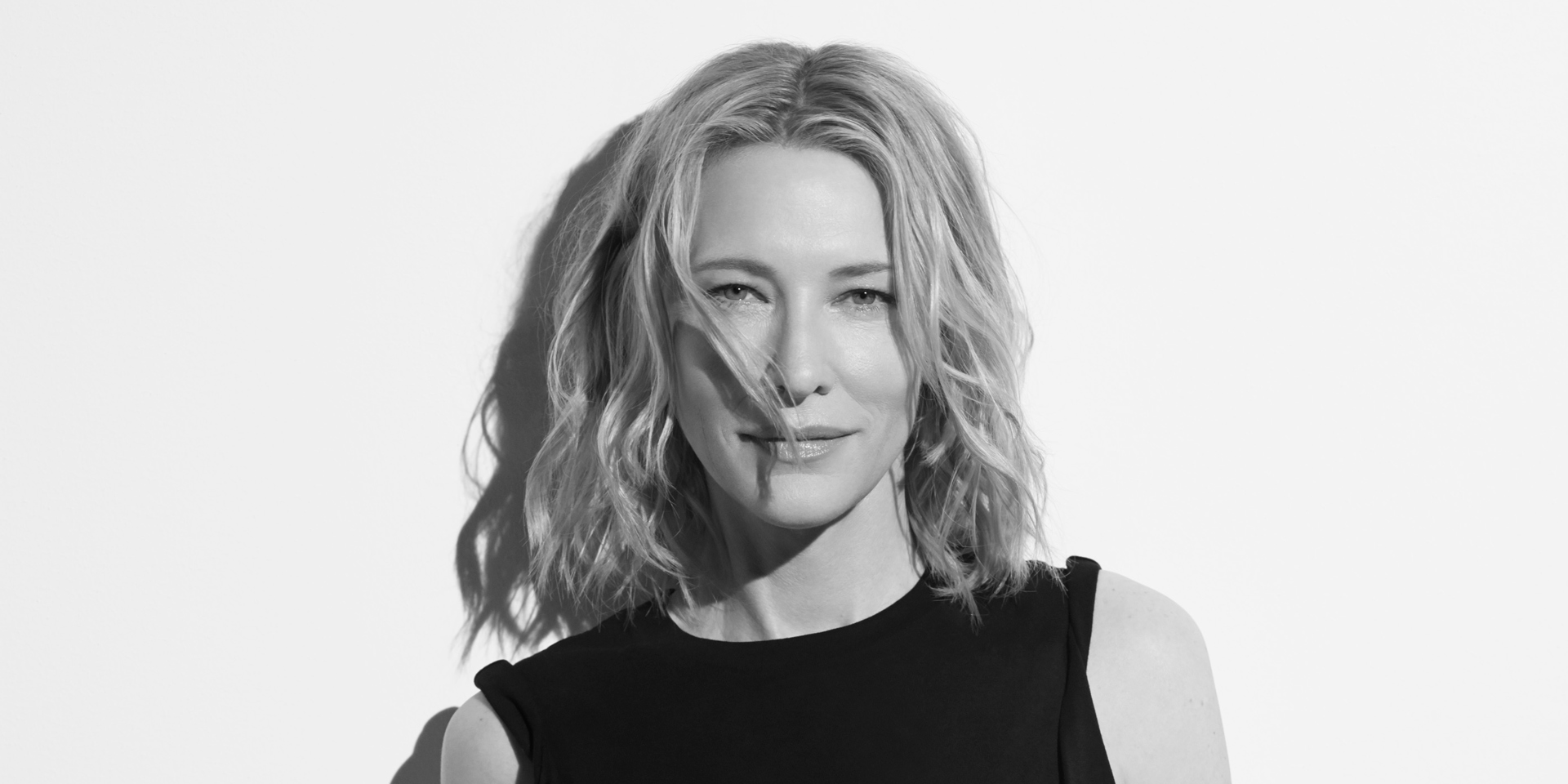 A black and white portrait of Cate Blanchett.