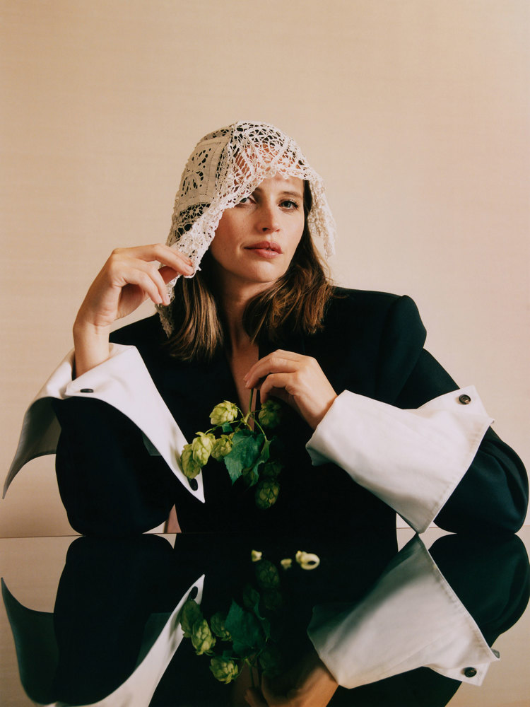 The actor Felicity Jones wearing a lace voilette.