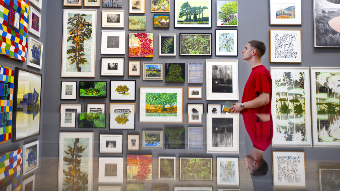 A young man at the Royal Academy Summer Show.