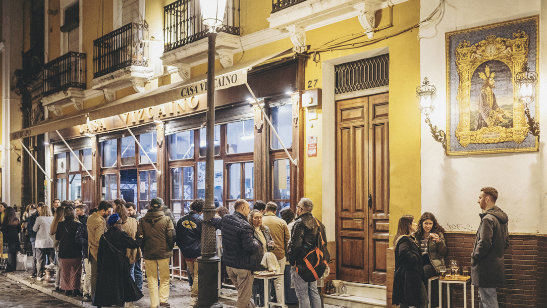 A busy bar at night in Sevilla.