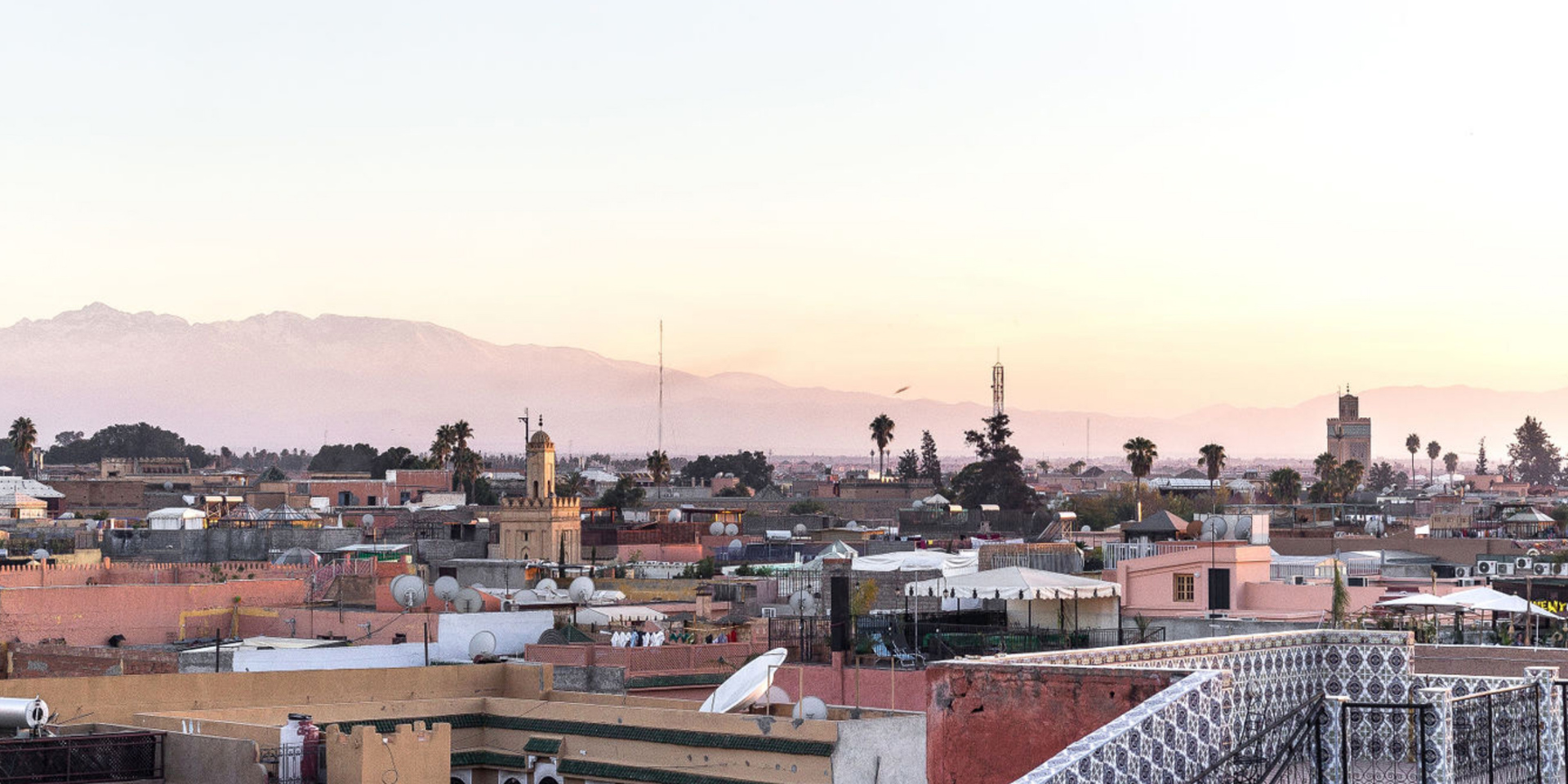 A wide view of Marrakech at sunset.