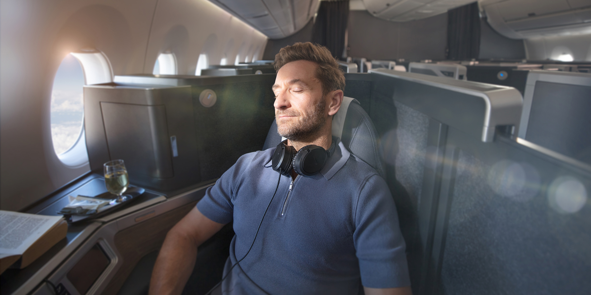 A man relaxing on a British Airways plane.