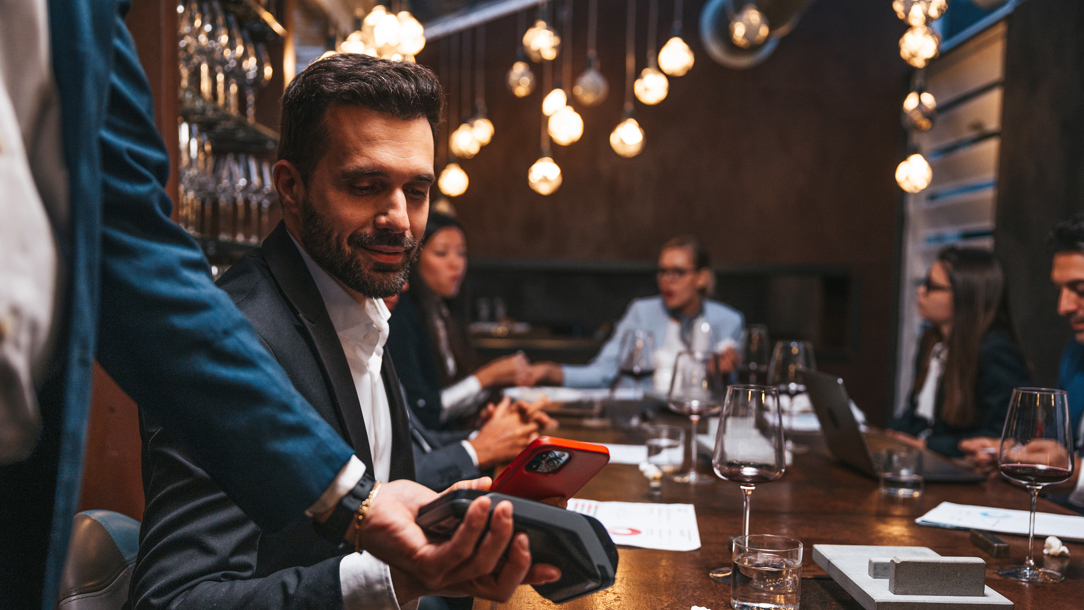 A man paying in a restaurant.