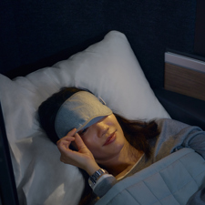 A woman falling asleep on a British Airways flight.