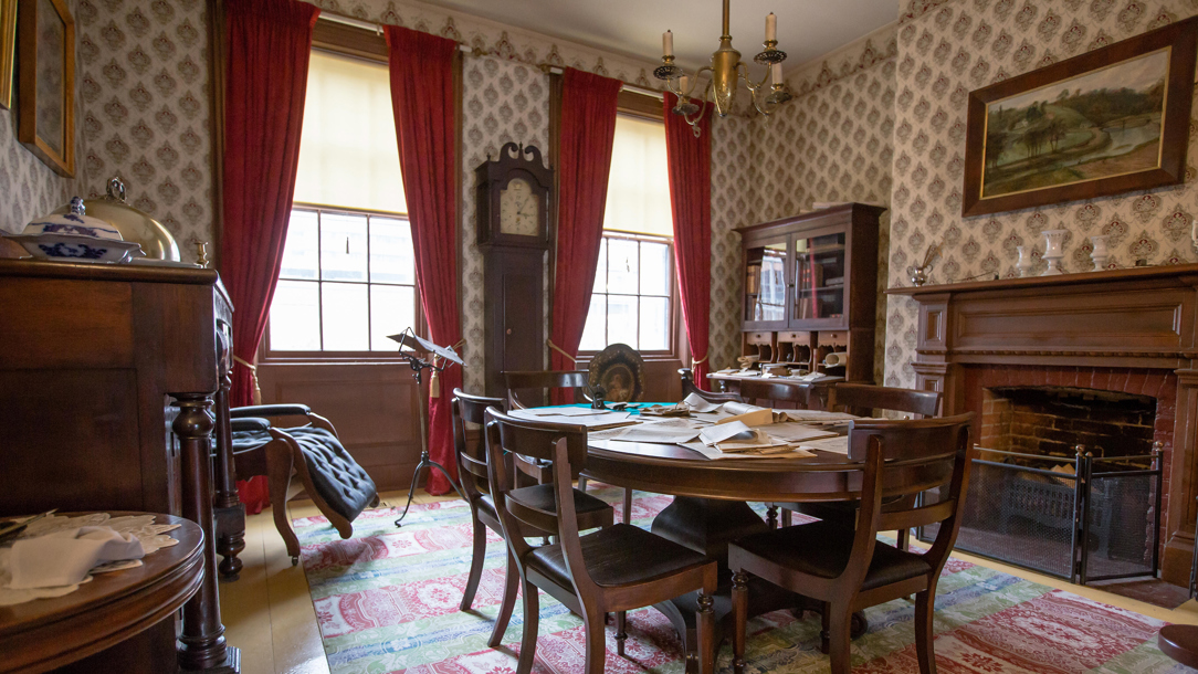 Inside an old room with Victorian furniture.