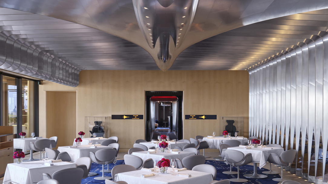 The dining room of Brooklands with an airplane inspired ceiling feature.