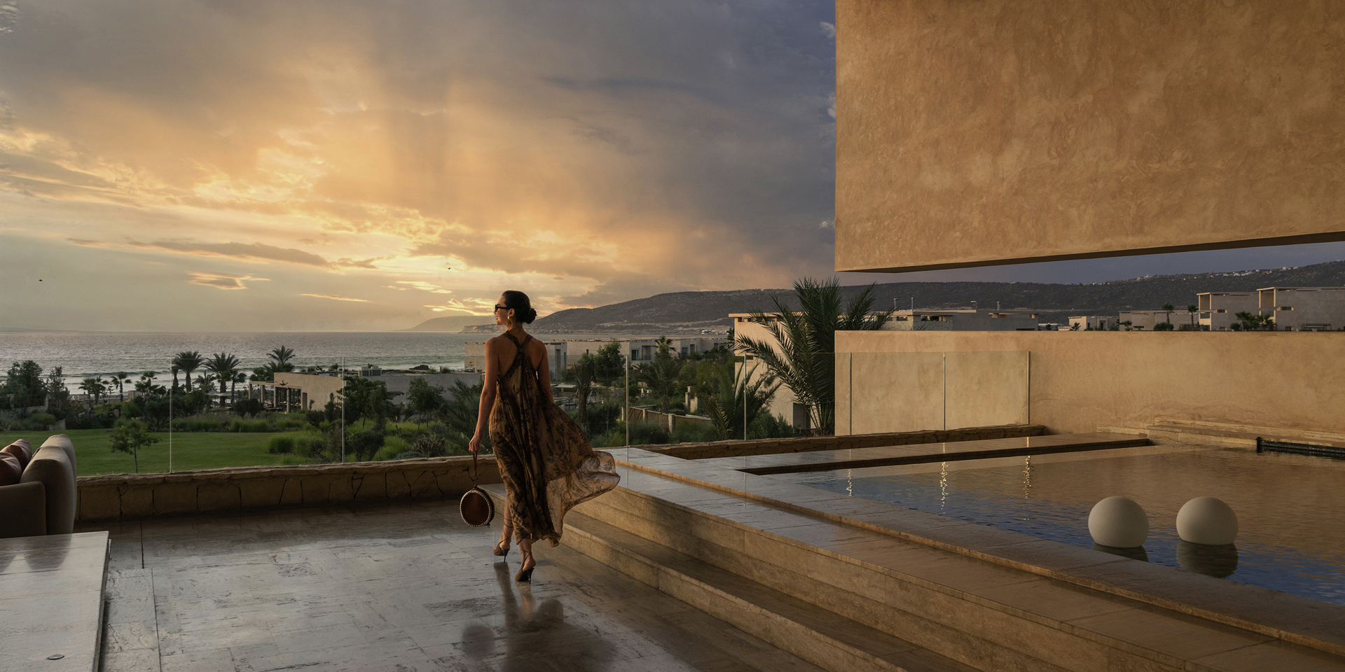 A woman at sunset at Fairmont Taghazout Bay.