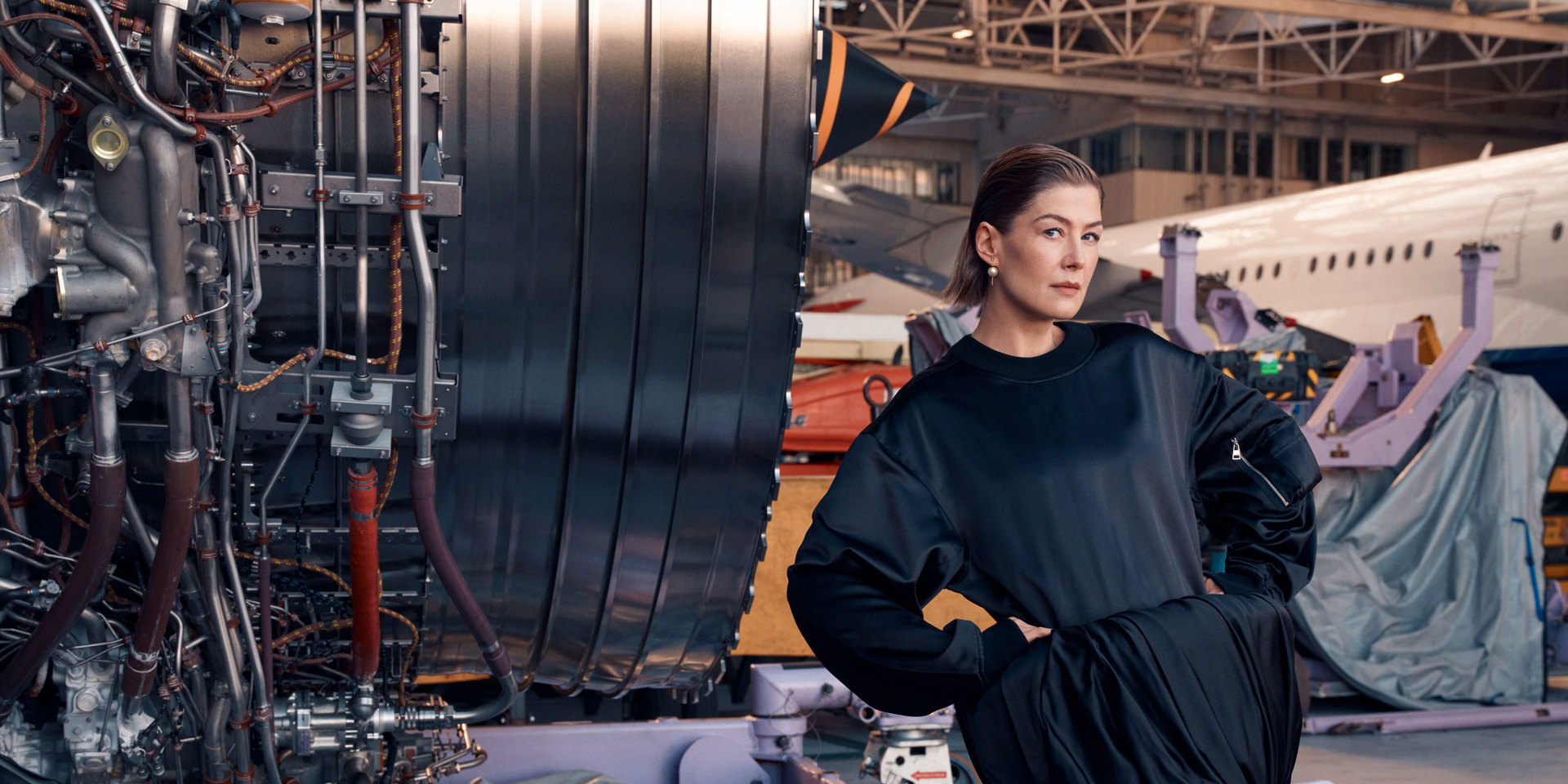 A portrait of Rosamund Pike in the British Airways hanger at Heathrow.