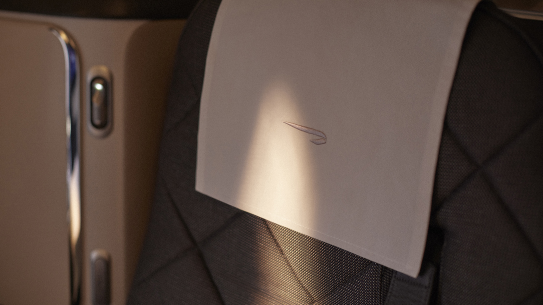 The British Airways speed mark symbol on a seat cover.