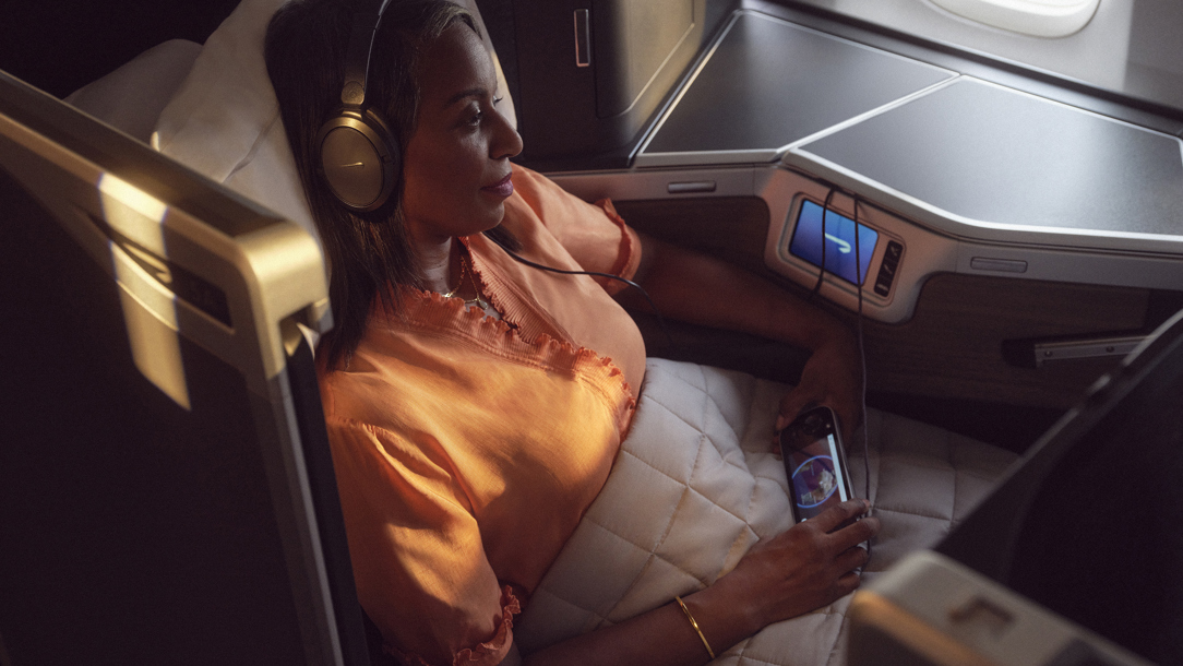 A passenger relaxing on a British Airways flight.