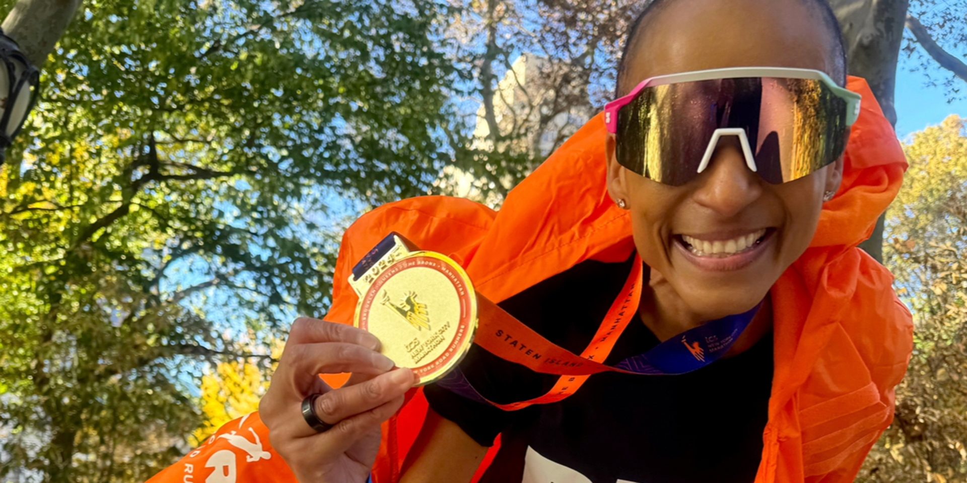 Contributor Adele Roberts with one of her many marathon medals