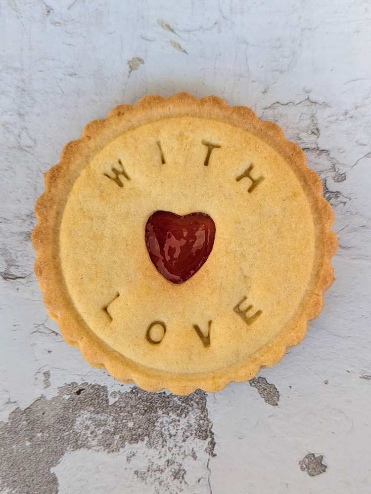 A biscuit with 'love' written on it.