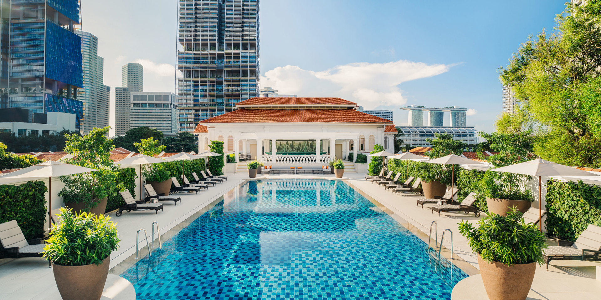 The rooftop pool at Raffles Singapore.