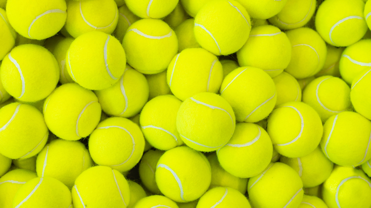 A still life photograph of tennis balls.