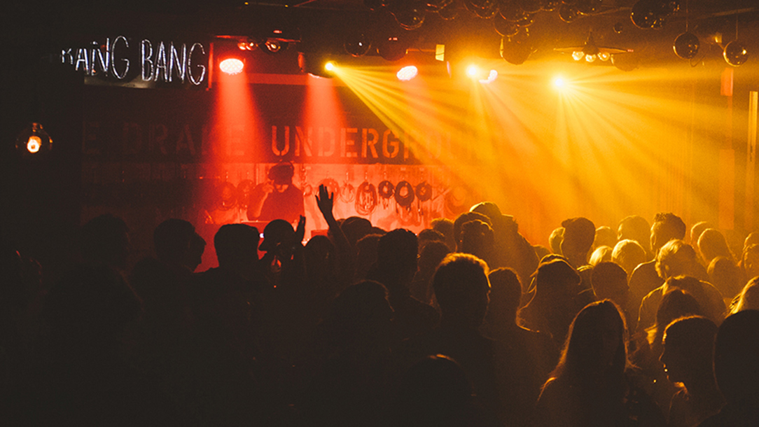 A nightclub lit with orange lights.