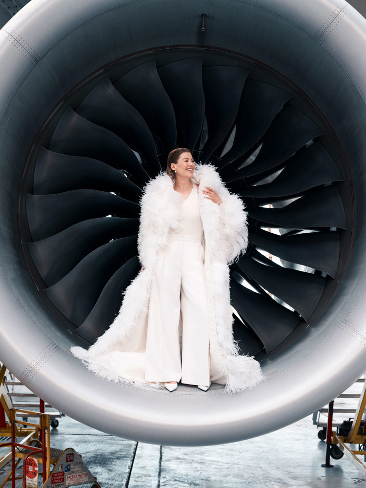 A portrait of Rosamund Pike inside the engine of a British Airways plane.