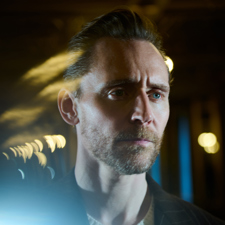 A close up photograph of Tom Hiddleston.