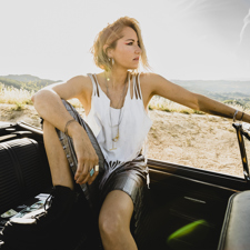 A portrait of contributor KT Tunstall in a car