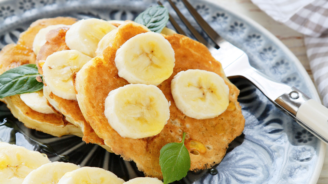 Pancakes with bananas on them.