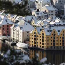 The Brosundet Hotel in Norway covered in snow.
