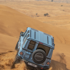 A Ineos Grenadier vehicle in a desert.